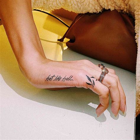 Tattoos On Hand Side